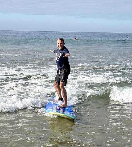 a man on a surfboard in the ocean