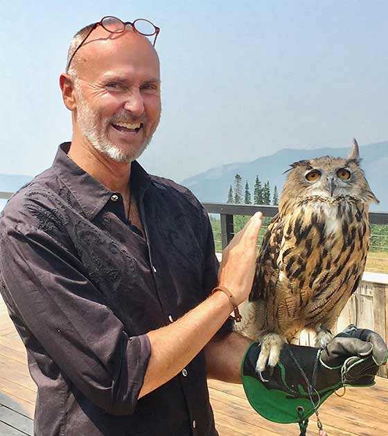 chip conley holding an owl