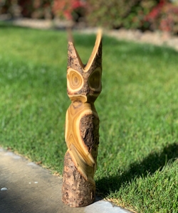 a wood carving on a tree stump